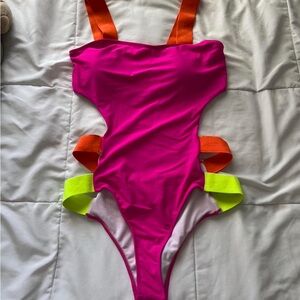 Vibrant Pink One-Piece Swimsuit with Orange and Green Straps